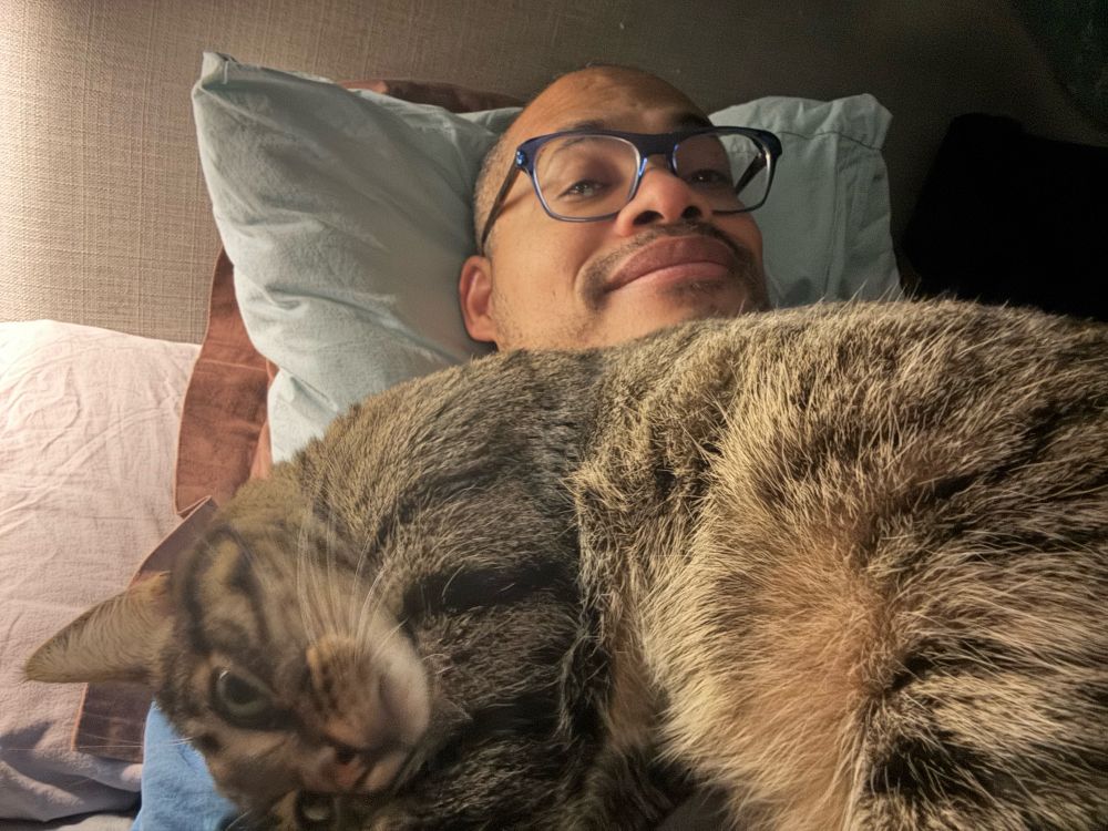 A baby cat with his dad