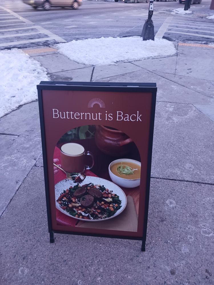 A sign thay says Butternut is Back and there's a picture of some food 