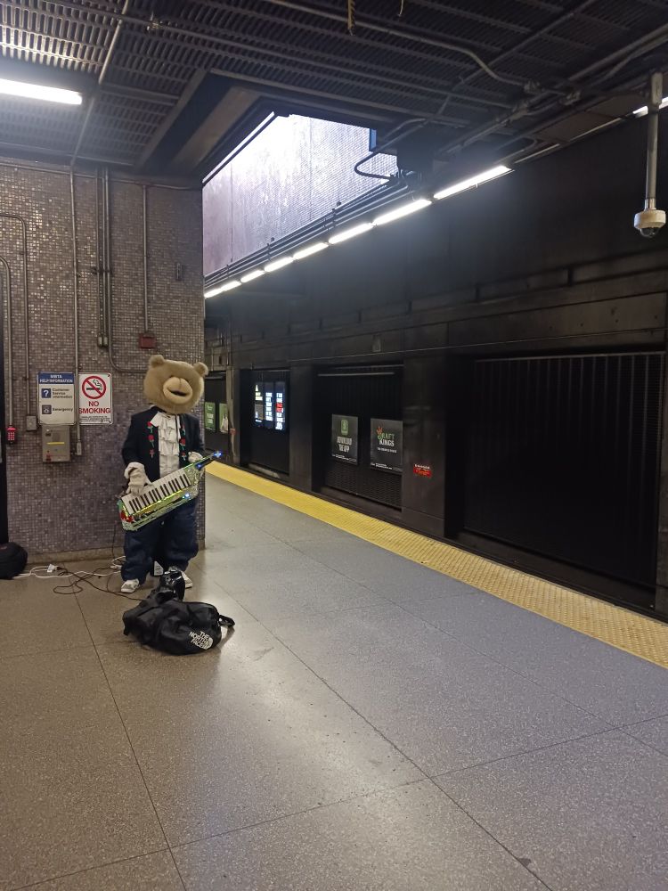 Keytar Bear playing music at Back Bay station in Boston 