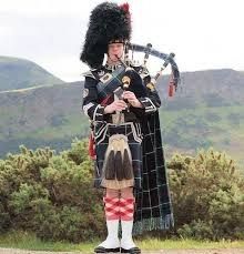 Scottish bagpiper.