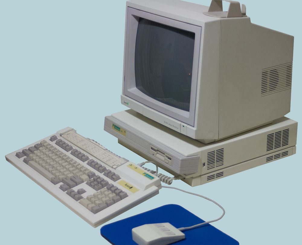Acorn Archimedes 400 series computer with a beige desktop unit, matching CRT monitor, full-sized keyboard, and a three-button mouse on a blue mouse mat. Released in 1987, it introduced the ARM architecture, which remains influential in modern computing.

Image by Paul Vernon, licensed under Creative Commons.