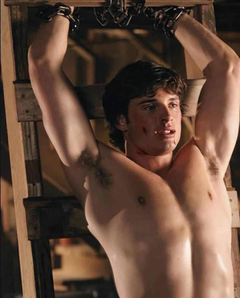 Tom welling as Clark Kent from smallville. His shirt is off and he’s been chained inside the Kent farm barn. Pits exposed!!!