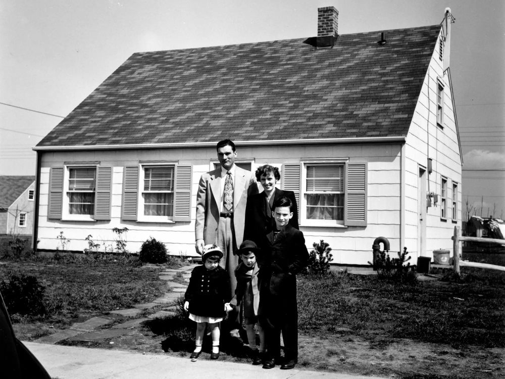 Truck supervisor Bernard Levey with his family in front of their home in the new Levittown, Pa., housing development in 1950. (Bernard Hoffman/Time Life/Getty Images)
