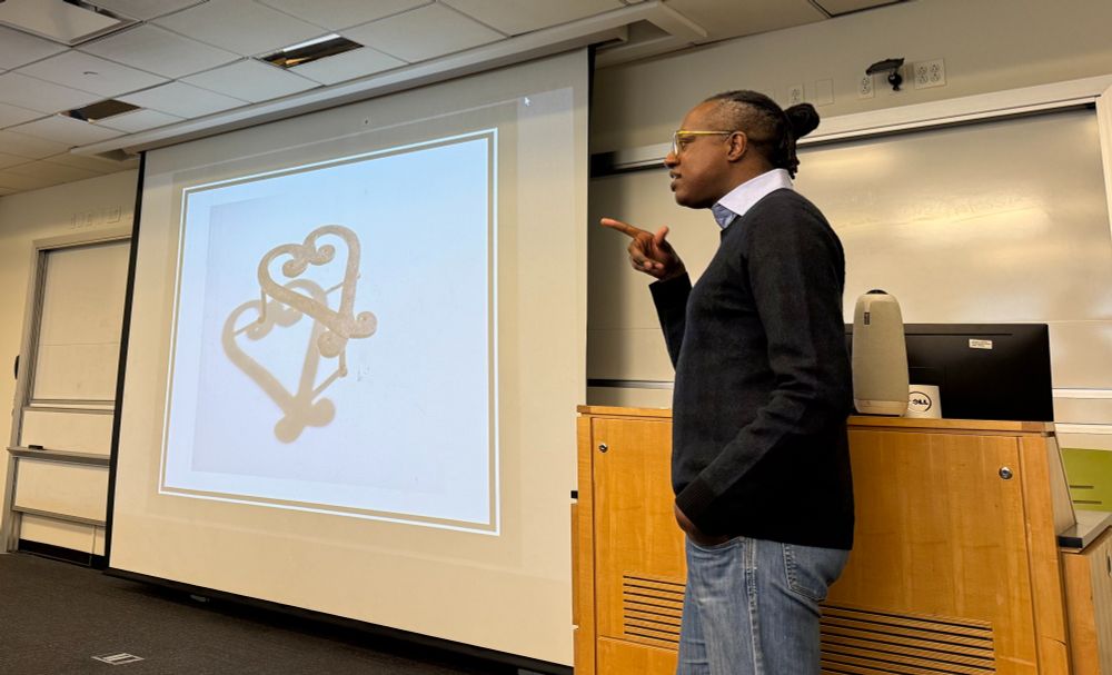 Dr. Brown giving a lecture on Black visual culture.