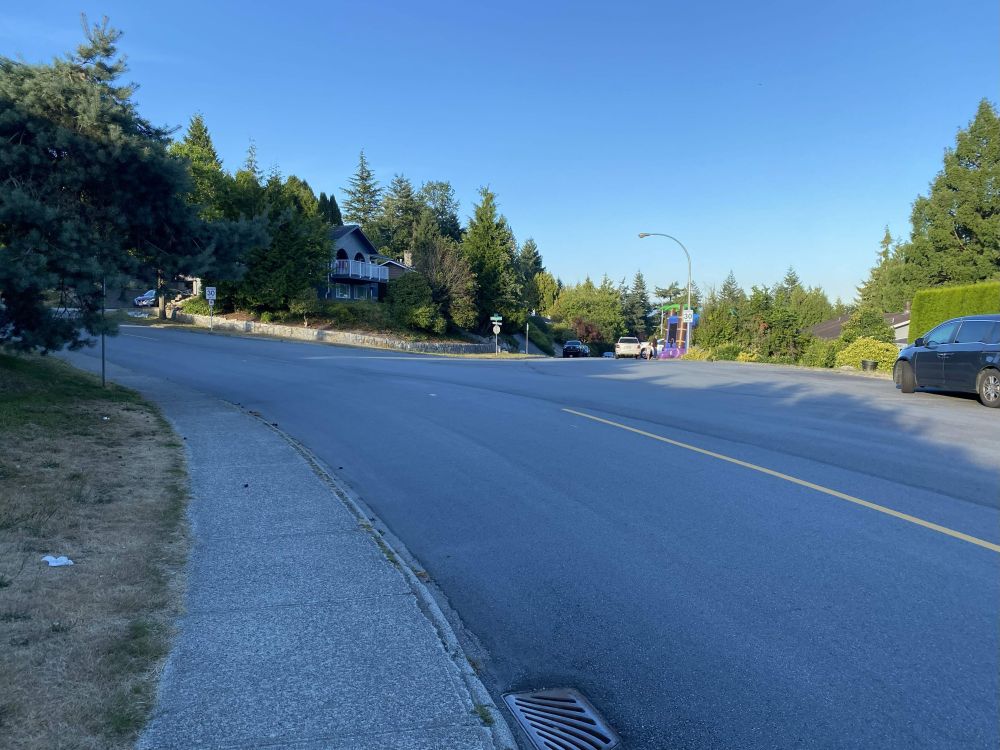 Very wide intersection of two quiet suburban streets (Harvard and Princeton) in Port Moody