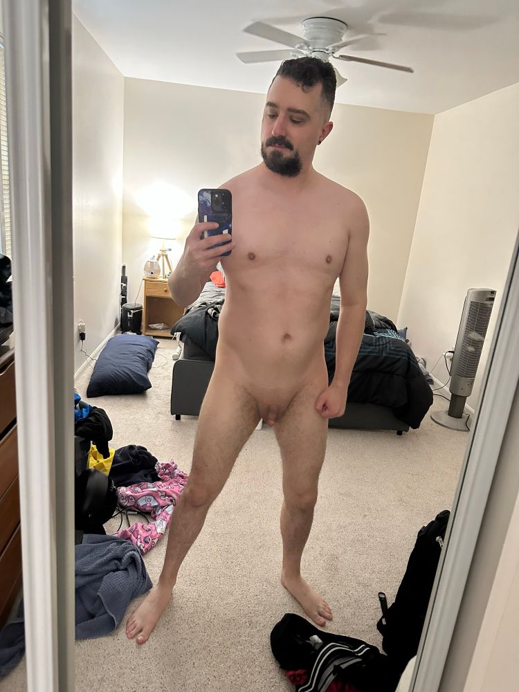 The author stands naked in front of a mirror, holding up his phone to take the picture. There’s a hint of muscle definition in his chest and shoulders, perhaps a slight bit of “tone” to his belly. 