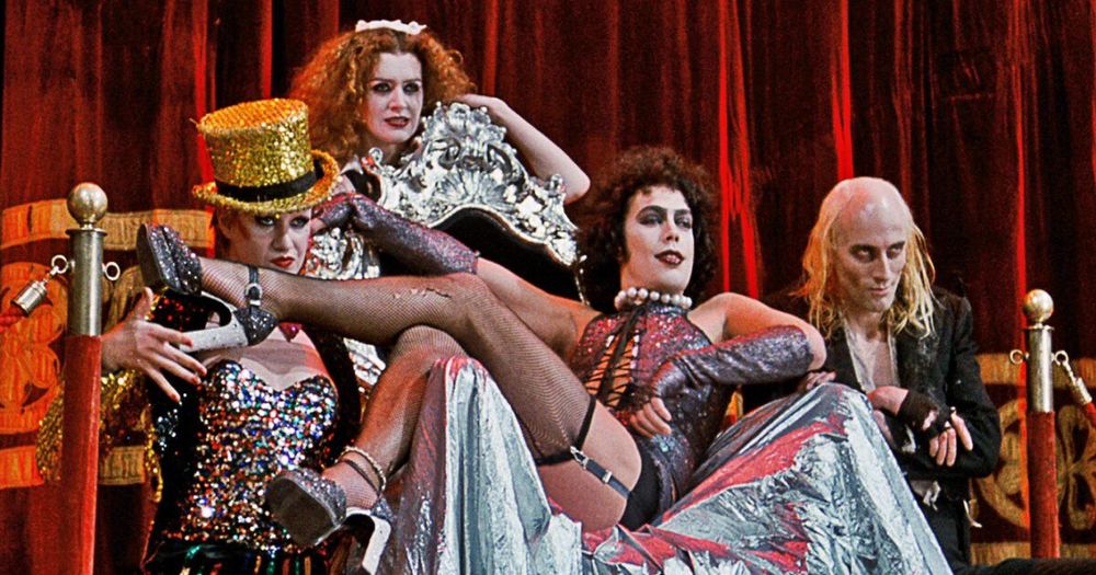 Still from "The Rocky Horror Picture Show", with Tim Curry, Richard O'Brien, Patricia Quinn and Nell Campbell on stage, performing "Sweet Transvestite".