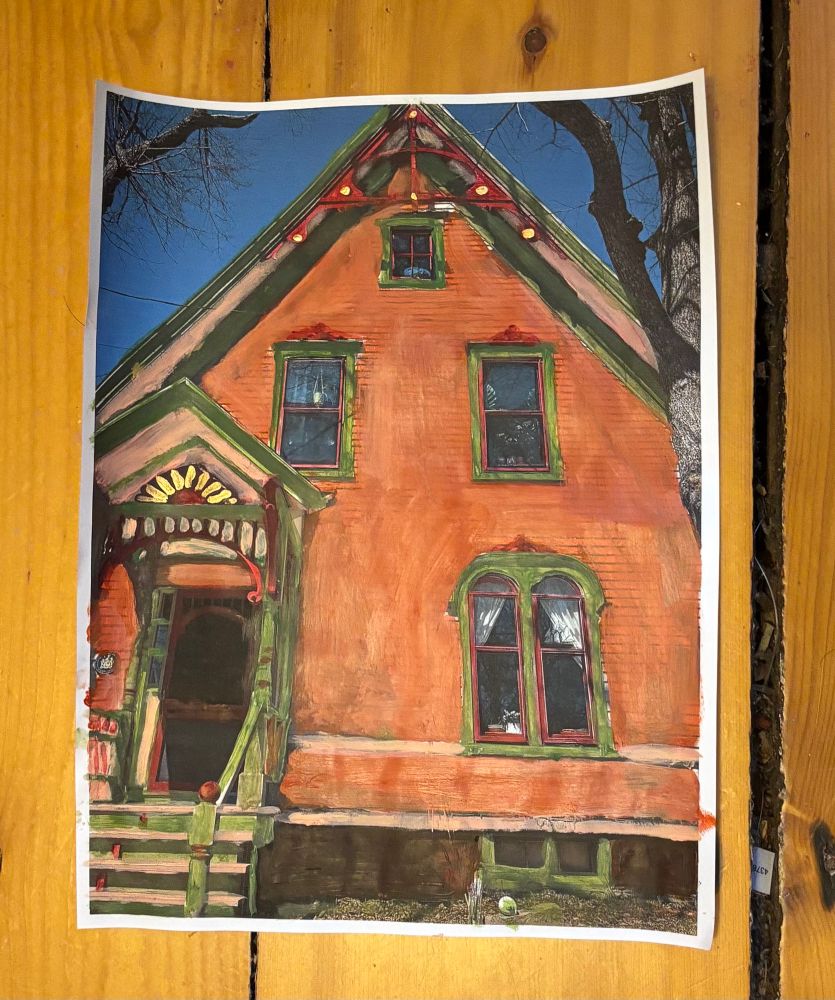 Mock up of an upcoming exterior painting project. Victorian home with gingerbread in terra cotta, olive green, peach and  alizarin crimson 