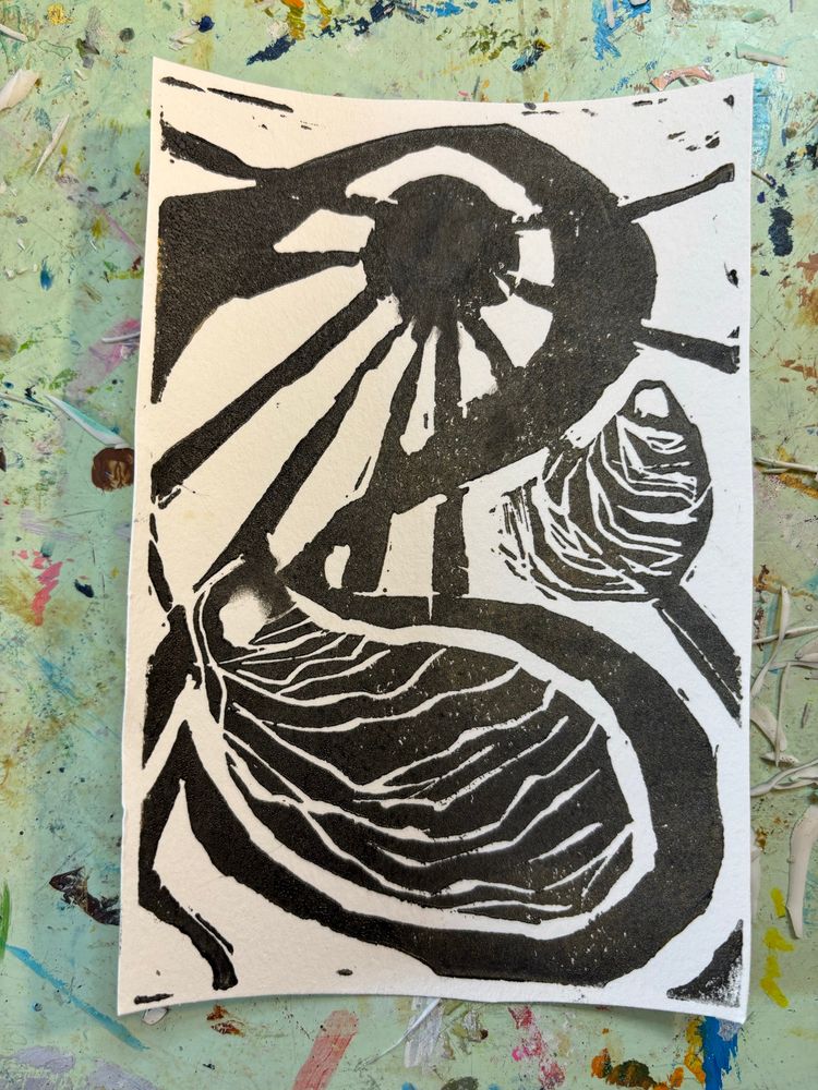 A rudimentary lino print of a full moon and two oysters 