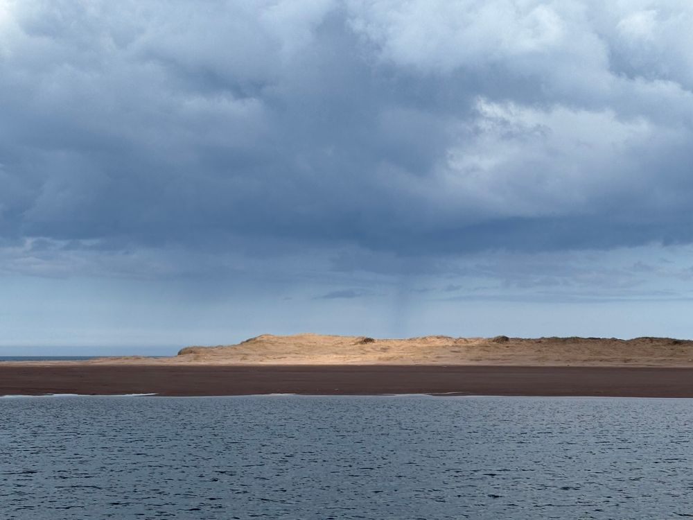 Big dunes across a bay on the north shore of PEI. You can walk around to them now that two hurricanes created a land bridge. #Blackbush #Tracadie 