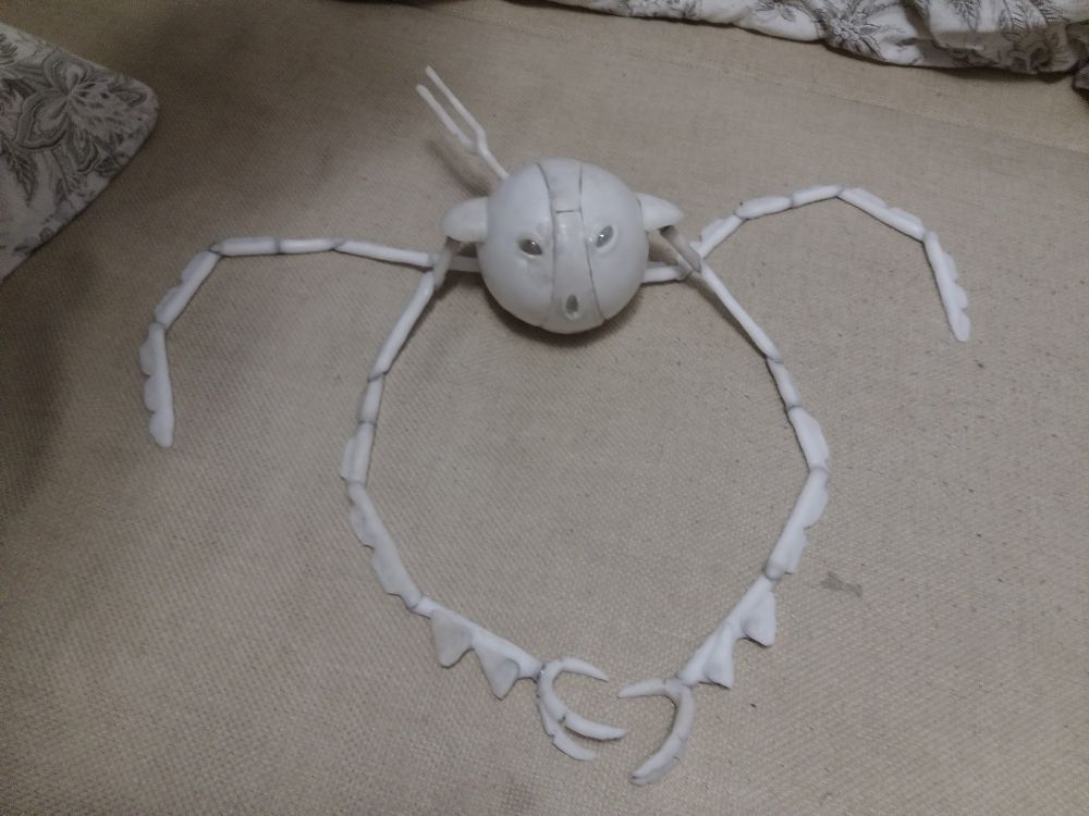 A clay/plastic ball with glass eyes and limbs