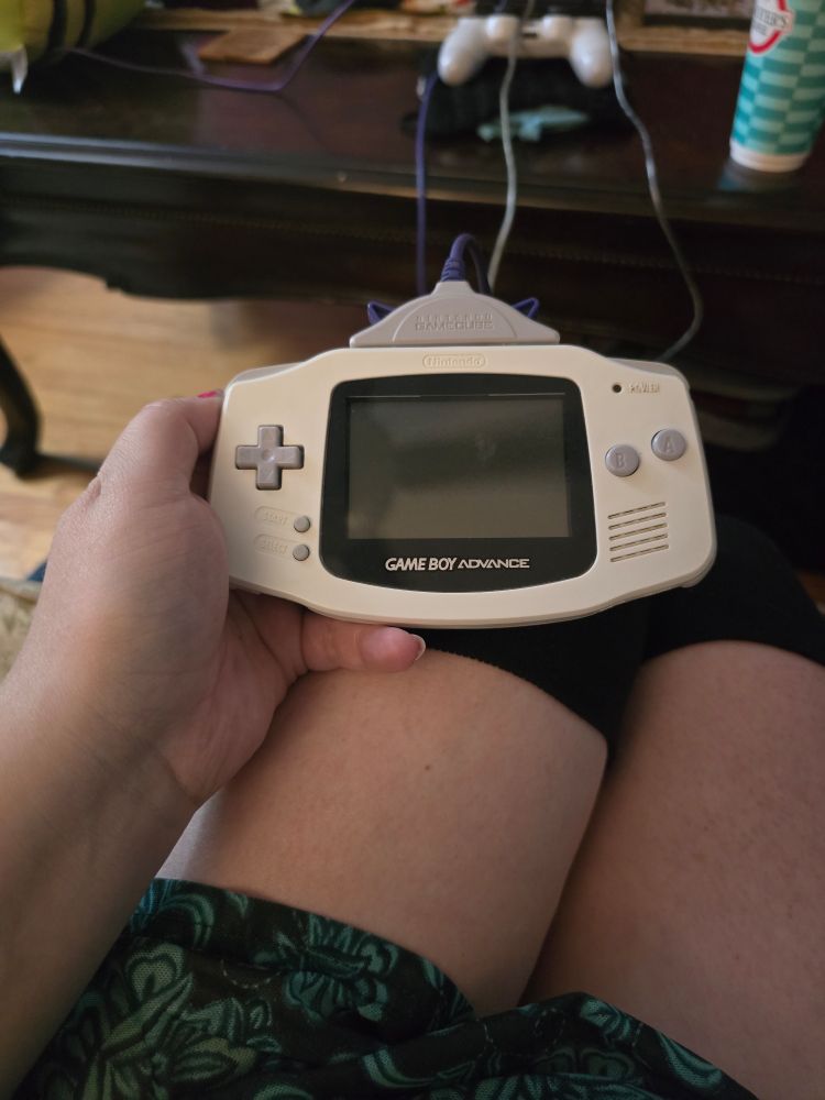 White Gameboy advance  plugged in to the gamecube
