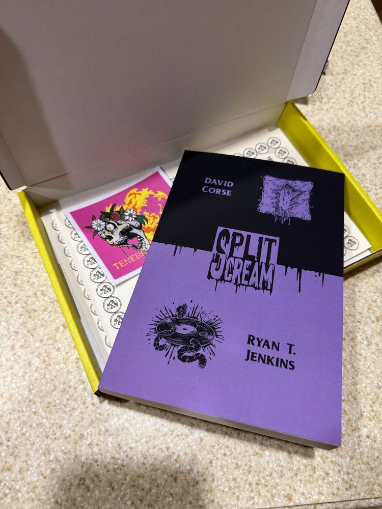 A back and purple book with the word Split Scream in the middle. The authors are David Corse and Ryan T. Jenkins. 