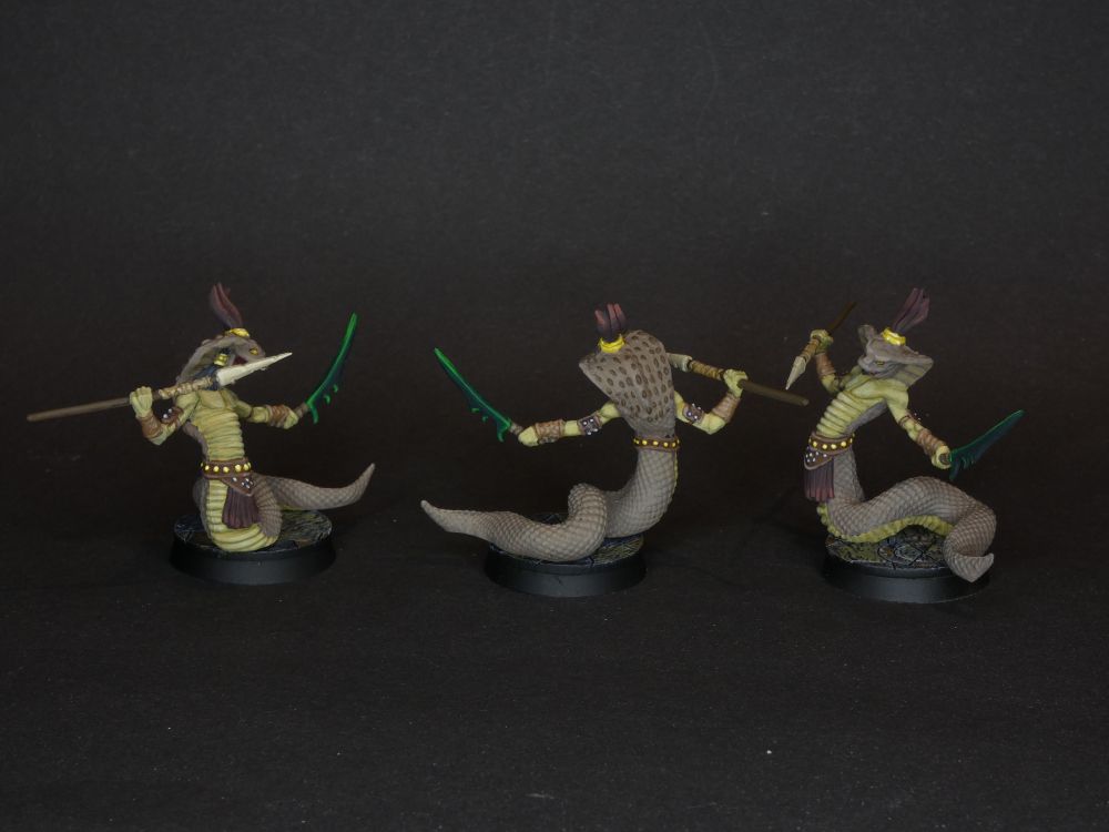 Three painted miniatures from Mansions of Madness: Serpent Persons.
