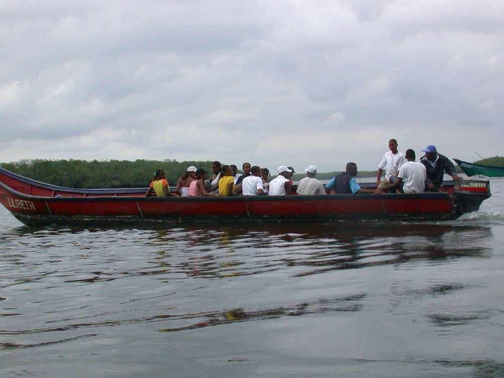 Average Colombians traveling by boat on the remote Pacific coast of Colombia. 