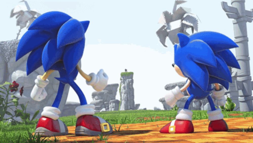 two sonic the hedgehogs are standing next to each other on a dirt road