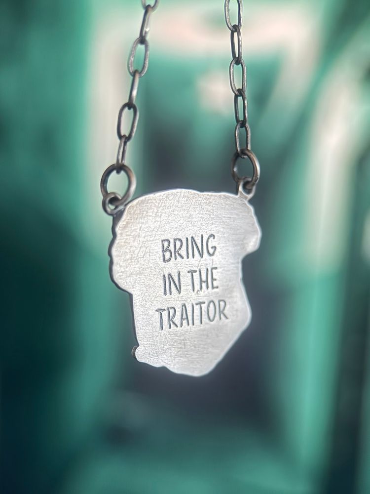 The reverse is engraved with the words BRING IN THE TRAITOR.