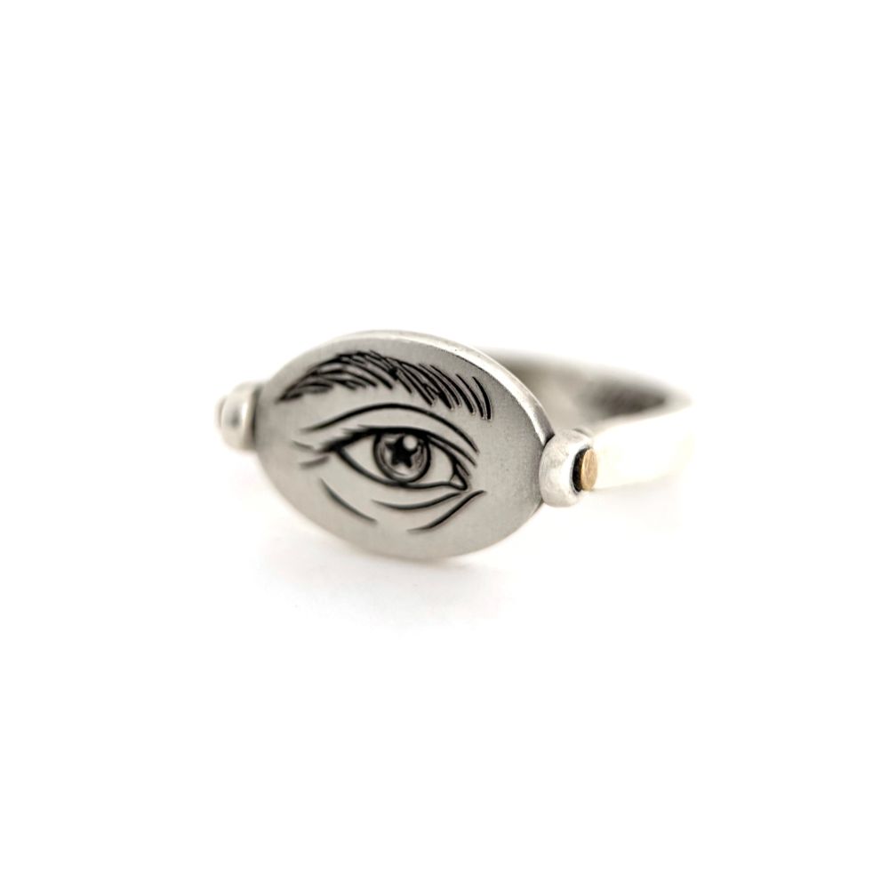 The other side is engraved with my sketch of Aziraphale’s eye.