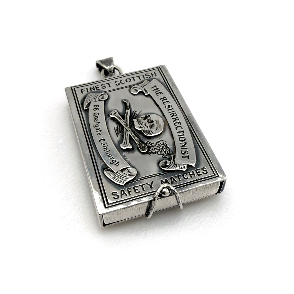 Another view shows the catch at the bottom which holds the tray in place.