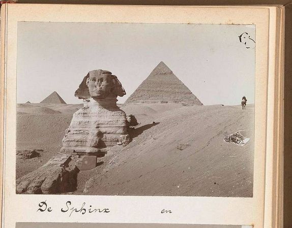 The image depicts the Sphinx and the pyramids in the Giza Plateau, Egypt.