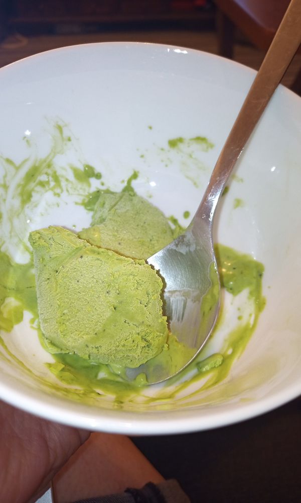 A bowl of bright green ice cream