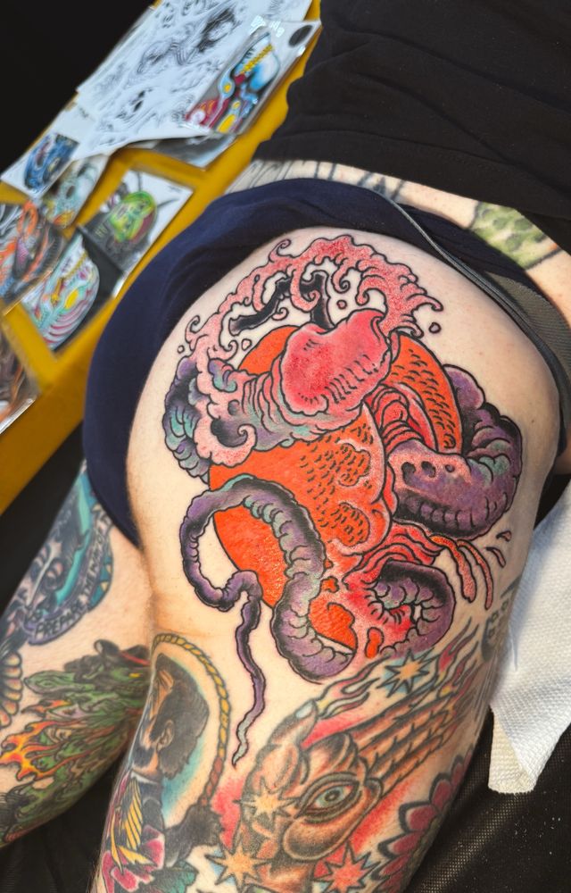 A shunga inspired tattoo of a peach and a snake. Mostly. 