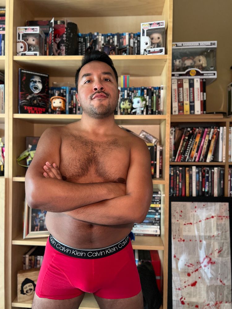 Me in front of my movie shelf in my red undies 