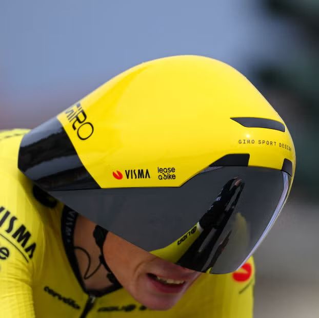 Professional cyclist Jonas Vinegaard wearing a specialized aerodynamic helmet of the sort that used to show up in time trials before the UCI banned them.  Someone else is going to have to try to actually describe the helmet.