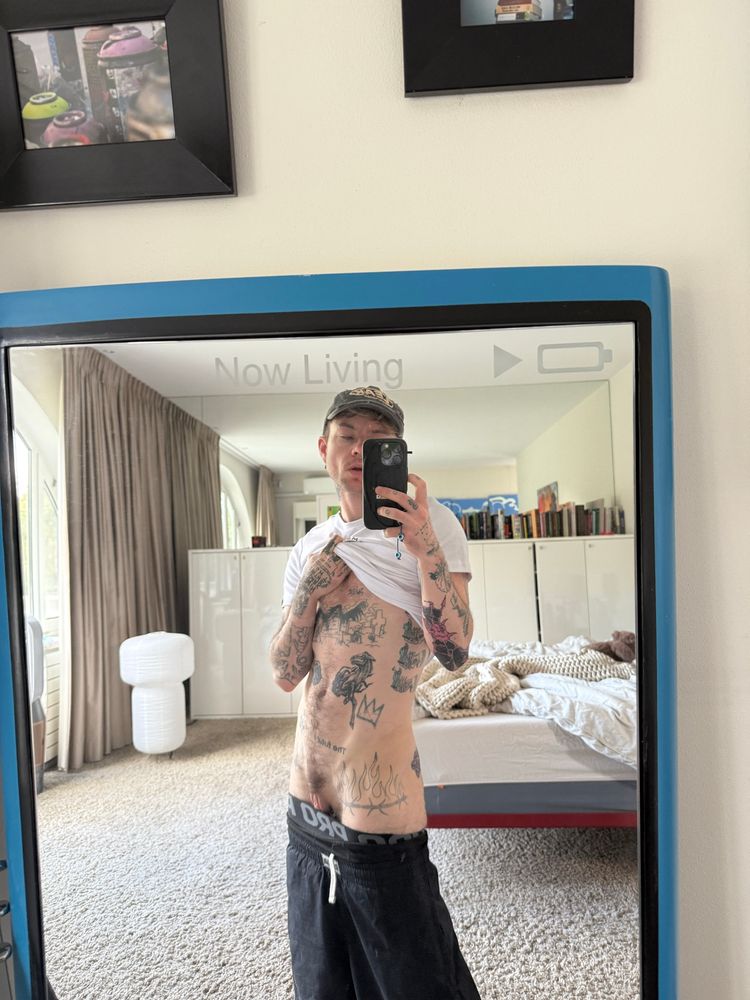 a mirror selfie of skips after the gym with his shirt pulled up and his pants lowered to reveal his abs and pussy