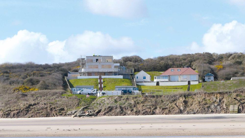 Our clifftop community is falling into the sea – why is nobody doing anything?