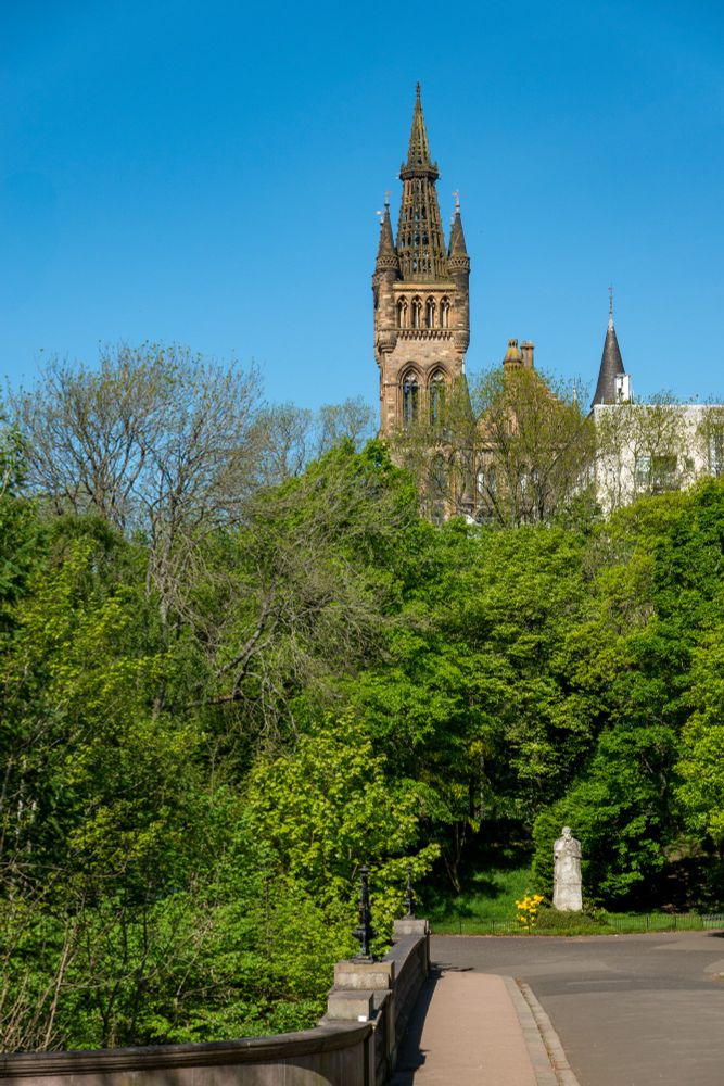 The tower of the Gilbert Scott Building seen from Kelvingrove Park.