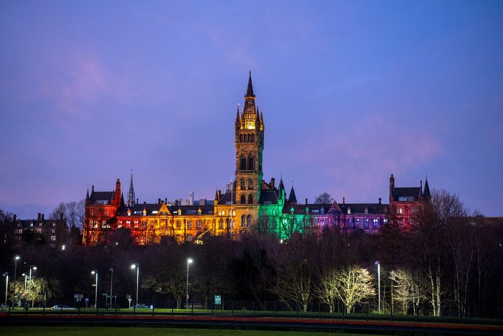 University of Glasgow illuminated in rainbow pride flag colours 
