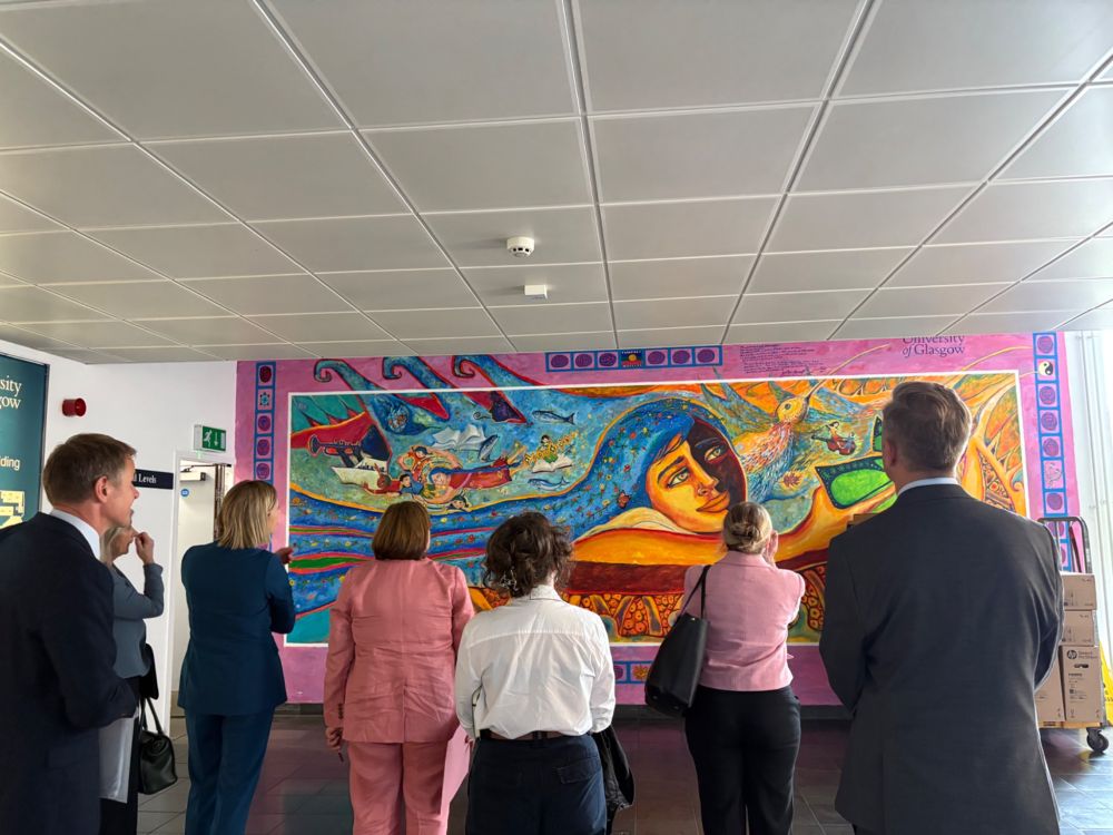 Jenny Gilruth and guests admire artwork at the School of Education