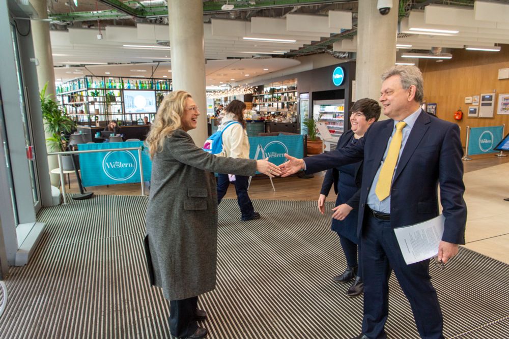 Gillian Martin MSP shaking hands with Prof Sir Anton Muscatelli as they meet at the entrance of the Advanced Research Centre.