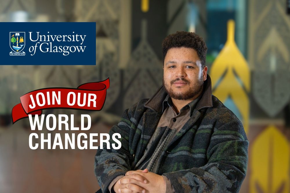 JMS Scholar Aaron Pocock leaning to one side with their fingers interlocked, wearing a buttoned shirt and winter coat. With the University of Glasgow logo and white text reading: Join Our World Changers 
