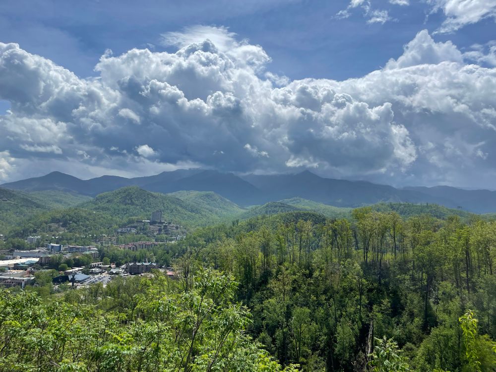 View of Smoky Mountains with low white clouds overhead