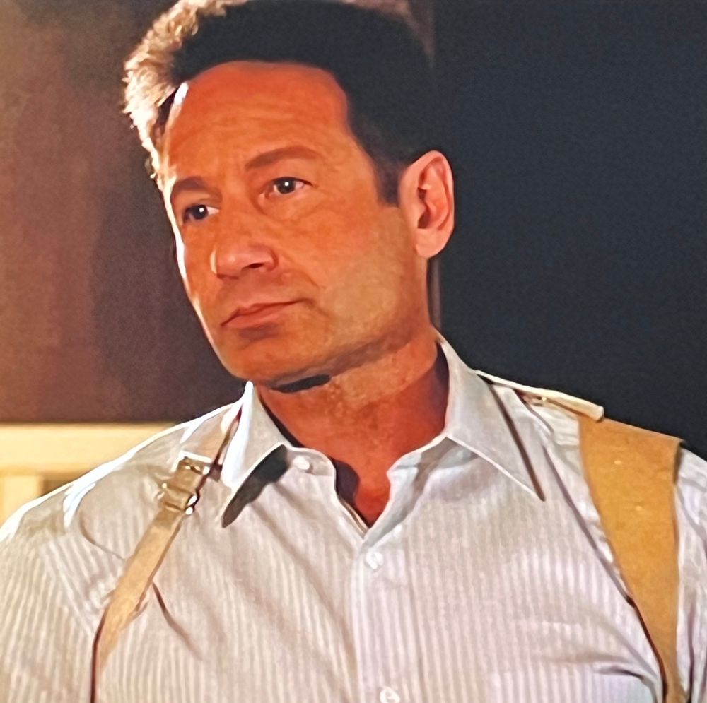Handsome man wearing a striped button-down shirt