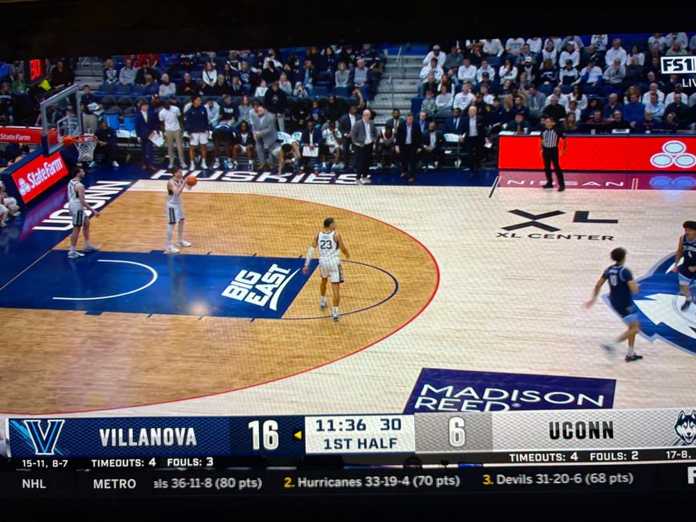 Two bald coaches going at it