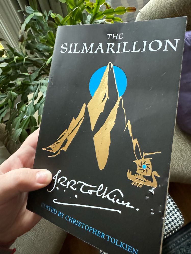 A copy of the Simarillion, with the bite marks of my cat in the cover.