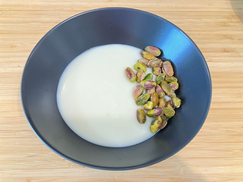 Milk pudding topped with pistachios. 