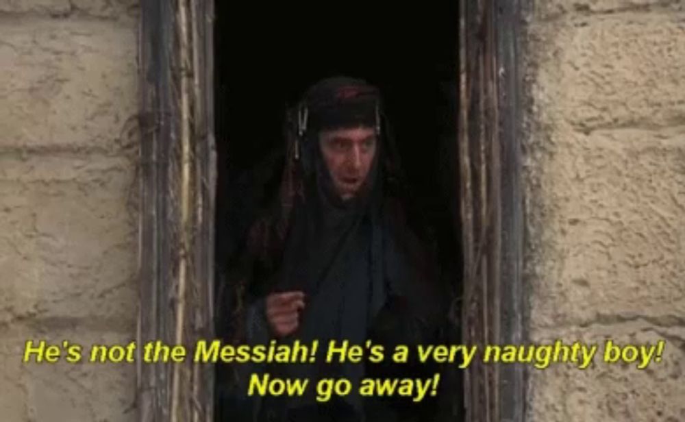 a man is standing in a doorway and says he 's not the messiah !