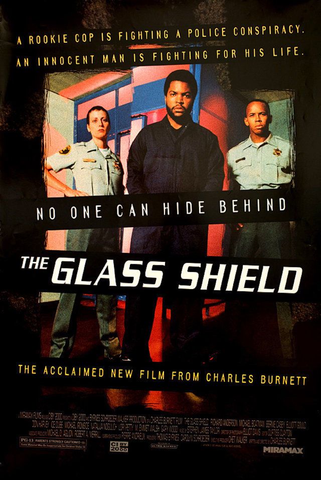 A poster for The Glass Shield by Charles Burnett. The text at the top of the poster says, A rookie cop is fighting a police conspiracy. An innocent man is fighting for his life. The poster features Ice Cube at the center with Lori Petty and Michael Boatman on either side of him, dressed in police uniforms. Beneath them it says No one can hide behind the glass shield. The acclaimed new film from Charles Burnett. 
