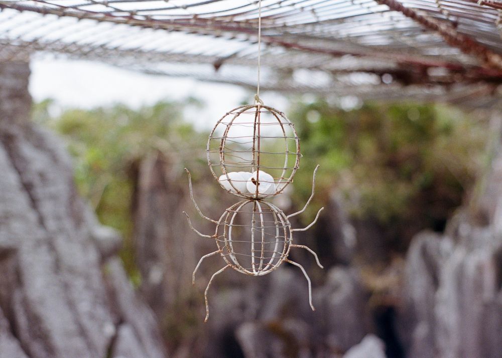 a zoom shot of a DIY wire spider