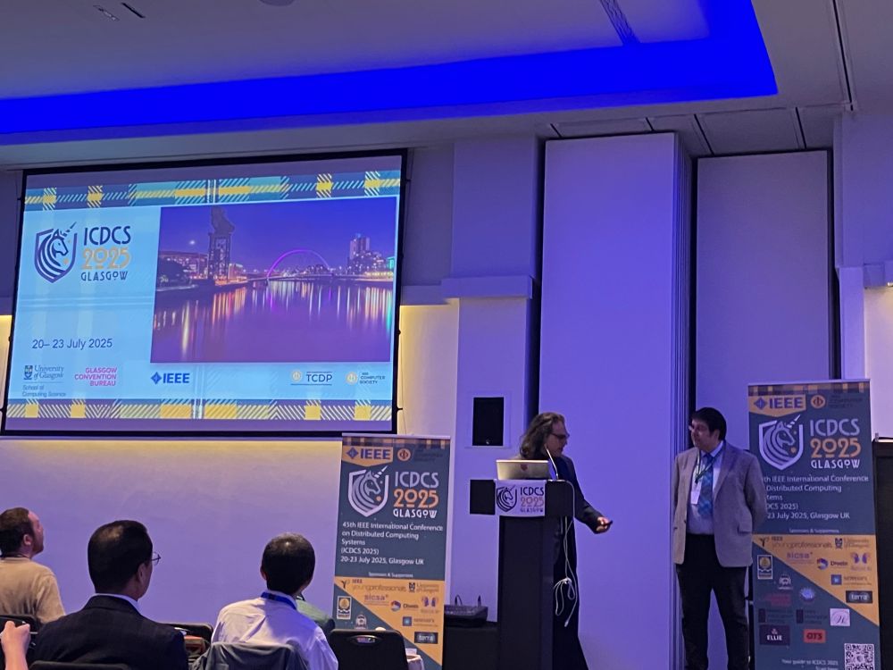 The general co-chairs of ICDCS 2025, Christos (Chris) Anagnostopoulos and Iadh Ounis, opening the main conference on Monday morning