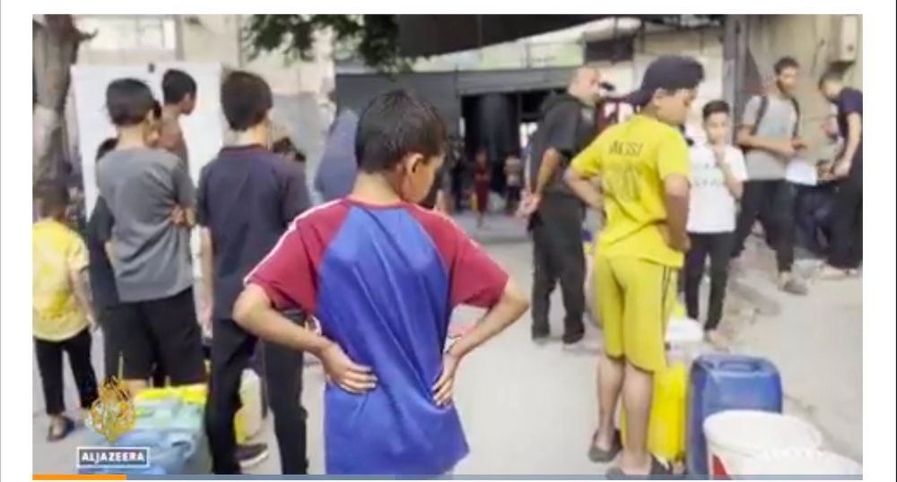 Photograph of a typical water queue in Gaza clipped from the Al Jazeera website