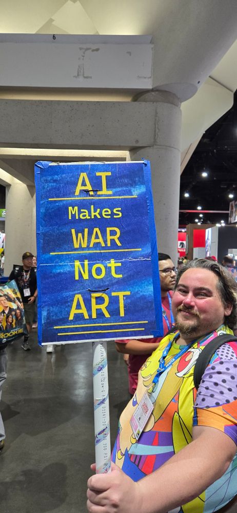 AU makes War not Art sign on the vendor floor at San Diego Comic-Con. 