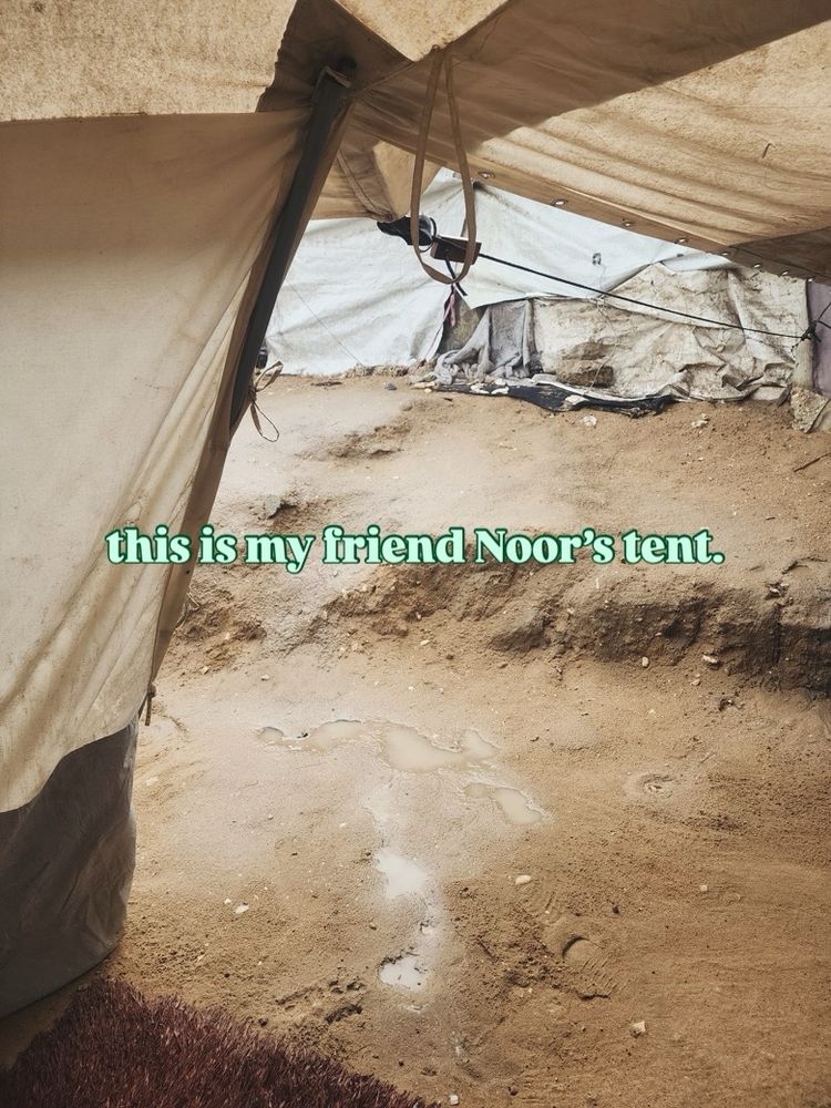 a photo of muddy ground from inside a tent, with a half-collapsed tent across the way, and text across the first third that says, “this is my friend Noor’s tent.”