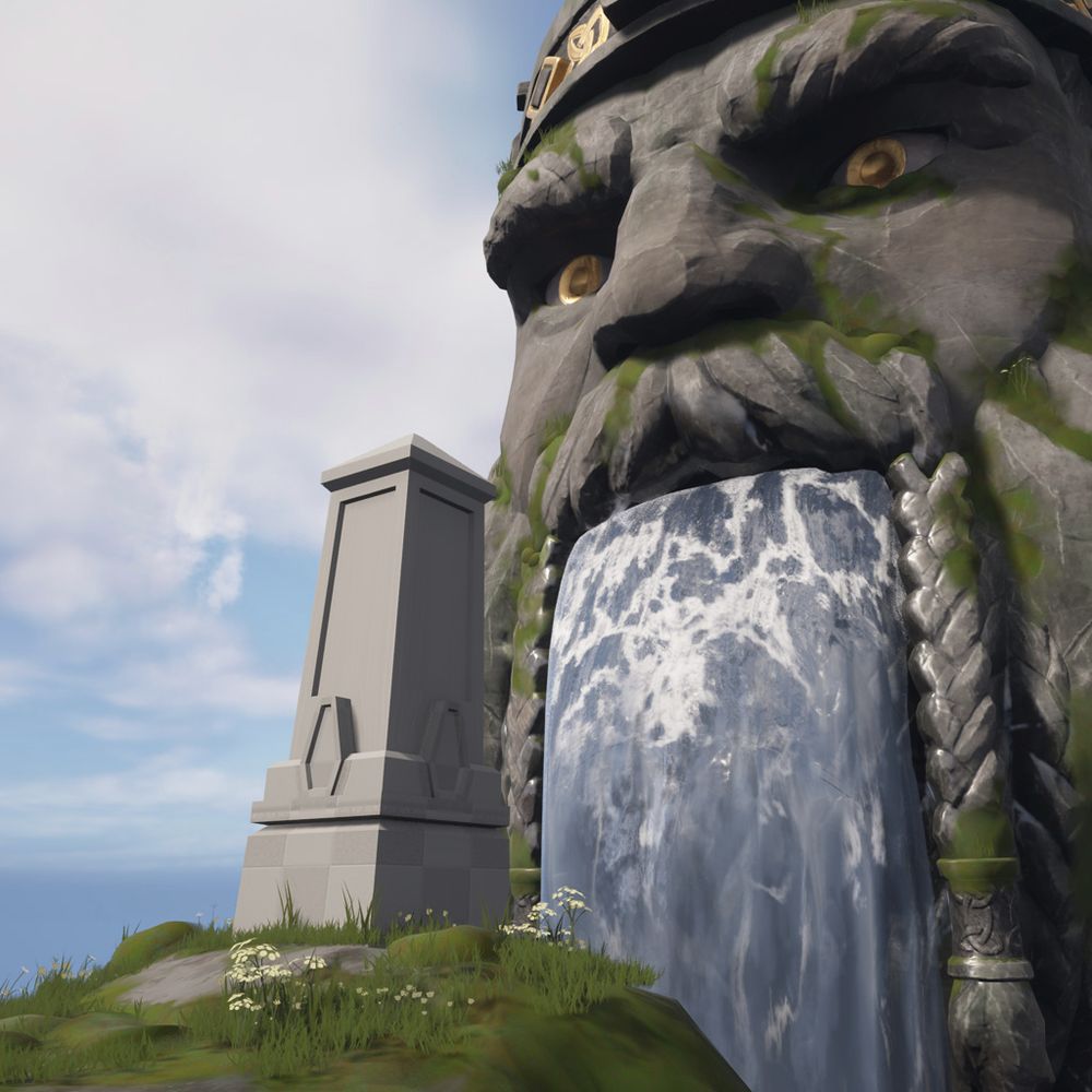 A block in of the previous obelisk in the environment. It sits on a rocky outcrop; behind it, a waterfall powers out of the mouth of a bearded face carved into a cliff-face.