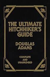 Hardcover copy of The Ultimate Hitchhiker’s Guide by Douglas Adam Complete and Unabridged. 
Black background with gold lettering. 