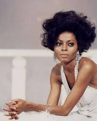A STUNNING photo of Diana Ross in the 1960s, wearing a white deep-plunging dress and big earrings
